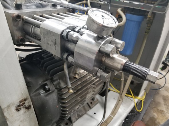 Attach pressure loading tool to each set of studs, rotating each tool stud by hand until tight