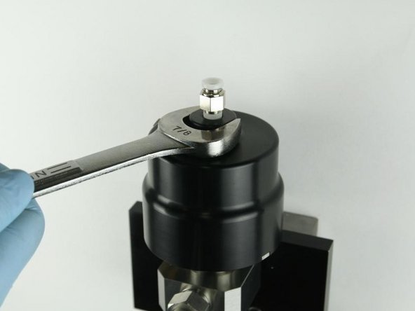 Loosen the actuator from the valve body using a 7/8&quot; wrench.