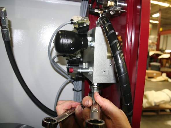 Connect hydraulic line from &quot;T&quot; fitting on hydraulic pump to port labeled PP on bottom of new manifold.