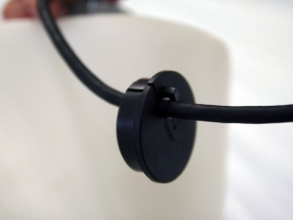 Drop the float gauge into the tank and bring the plug end through the grey opening at the top. Attach the rubber stopper to the cord and reinsert into the grey opening. Make sure to adjust the cord to be 10” from top of tank to metal bullet.