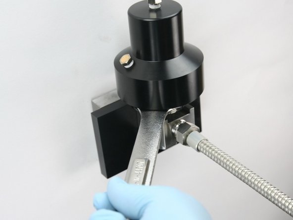 Unthread the actuator from the valve body using a 1-1/8&quot; wrench.