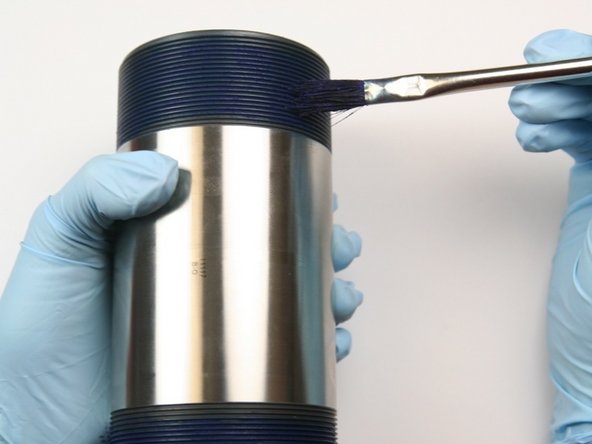 Apply blue goop to both threads of the high-pressure cylinder.