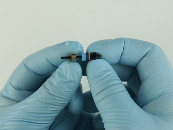 Slide the back-up ring on to the poppet stem behind the high-pressure valve seal.