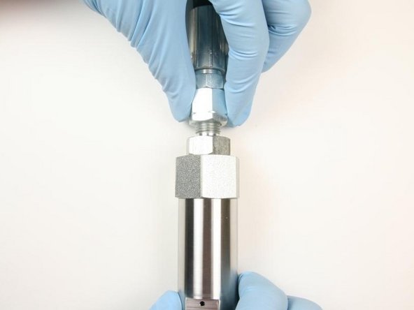 Thread the hydraulic hose on to the hydraulic fitting.