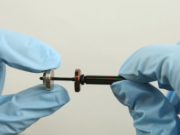 Slide the brass back-up ring on to the valve stem point with the chamfer side away from the stainless steel back-up ring.