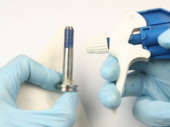 Clean the swivel shaft of all lithium grease and Blue Goop with isopropyl alcohol or similar cleaning agent.
