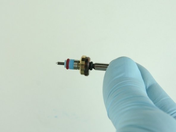 Slide the hoop and the high-pressure valve seal onto the valve stem with the hoop towards the brass back-up ring.