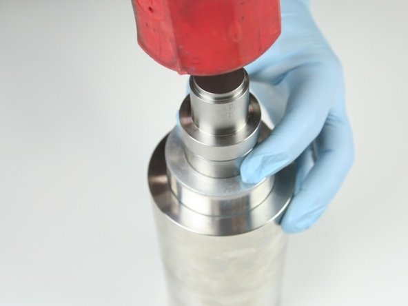 Use a rubber mallet to set the hoop into the high-pressure cylinder (until the push tool bottoms out).