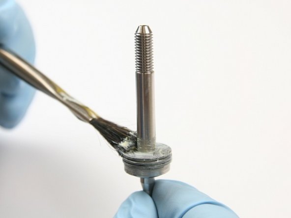 Apply lithium grease to the top of the thrust washer.