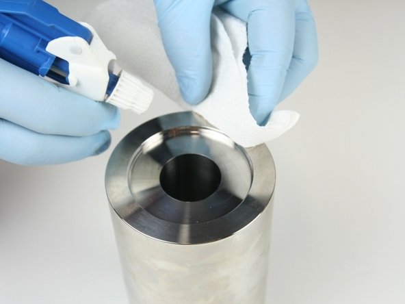 Clean the high-pressure cylinder once more to remove all excess material from Scotch Brite