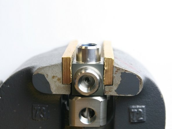 Put the swivel housing into the vise.