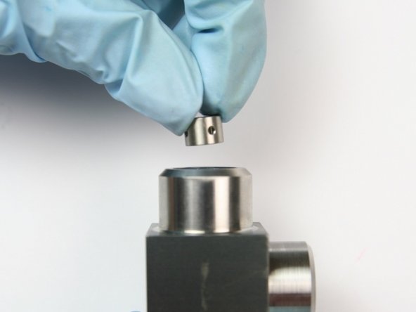 Put the spacer into the swivel housing behind the high-pressure seal assembly.