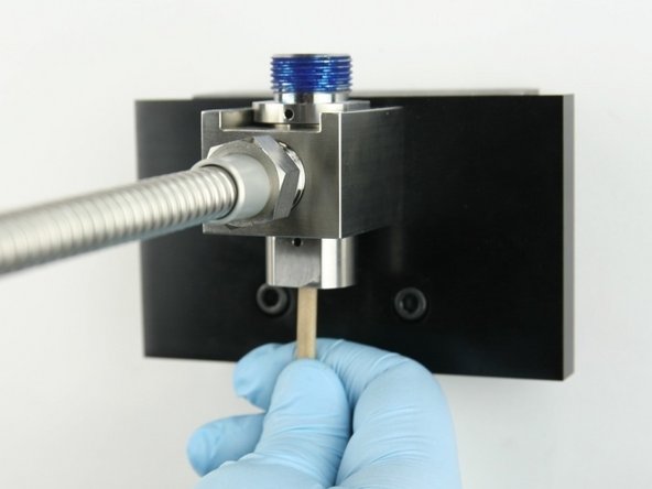 Remove the old valve components from the valve body with the included dowel.