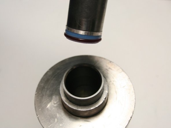 Put the installation tool, with the hoop and seal, into the sleeve.