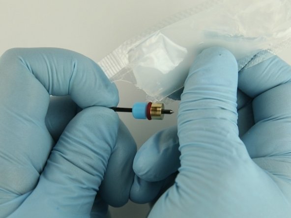 Apply a high-pressure lubricant or similar (11136) to the  outside diameter of the high-pressure valve seal.