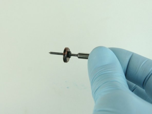 Slide the stainless steel back-up ring on to the valve stem point with the chamfer side towards the O-ring.