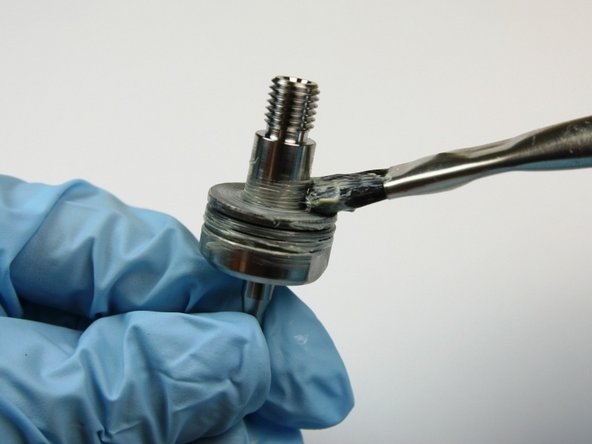 Apply lithium grease to the top of the thrust washer.