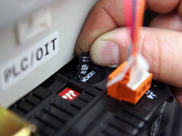 After program has been copied to microSD card, remove card from computer.