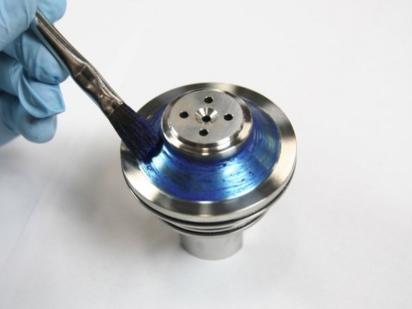 Apply light coat of blue goop to tapered (sealing) face of check valve