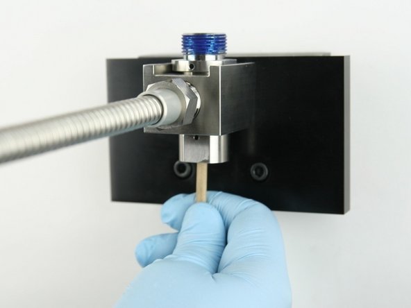 Remove the old valve components from the valve body with the included dowel.
