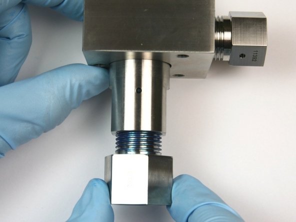 Thread the outlet adapter into the valve body.