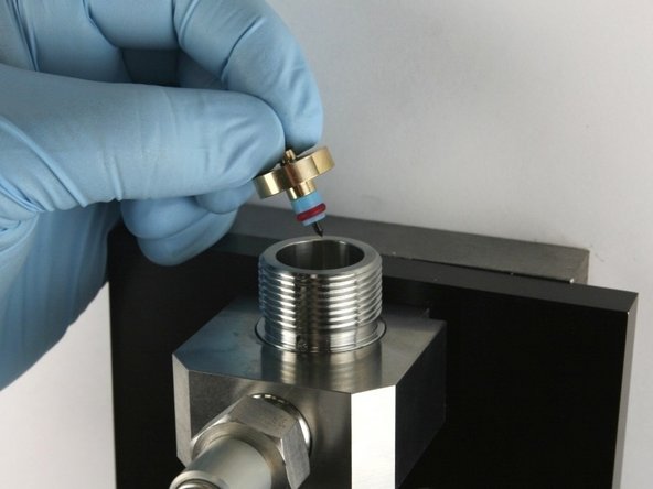 Put the needle point at the top of the valve body.