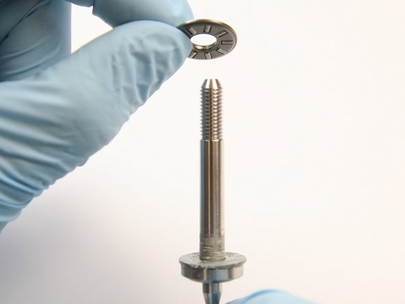 Put the thrust bearing onto the swivel shaft.