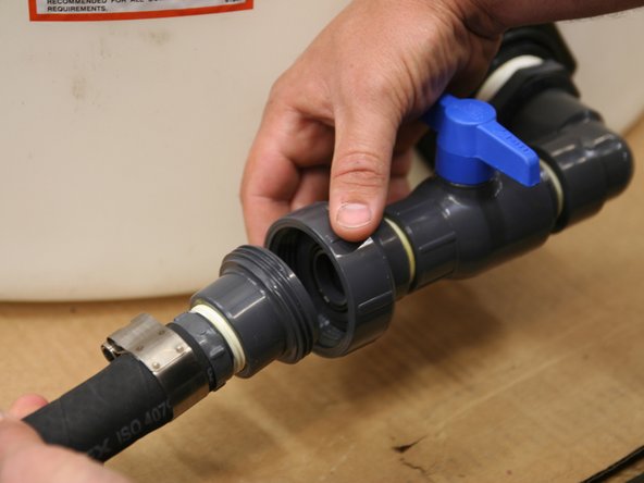 Connect the union fitting from the boost pump to the atmospheric tank.