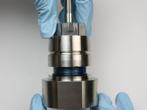 Thread the bearing half onto the seal half of the swivel housing.