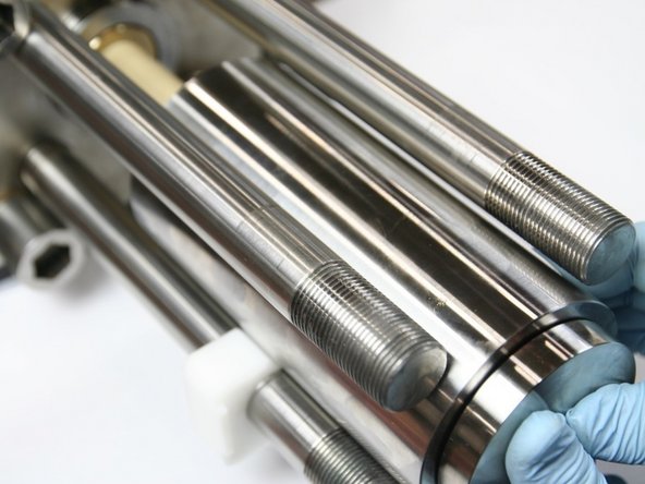 Push HP cylinder onto plunger using mounting cradle as a guide and seal installation spacer tool as a push tool