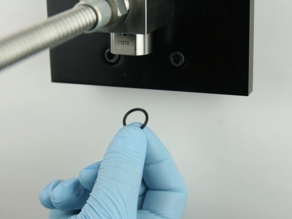 Put the  O-ring behind the poppet seat so it is held in place.