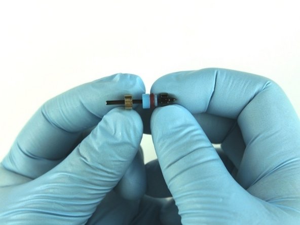 Slide the  back-up ring on to the poppet stem behind the high-pressure valve seal.