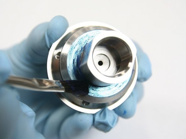 Apply light coat of blue goop to bottom step of check valve