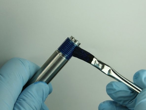 Reapply Blue Goop to the threads of the nozzle tube.