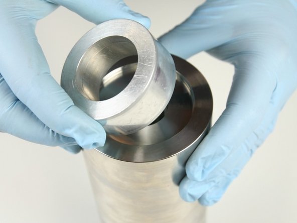 Put the locator tool on the high-pressure cylinder.