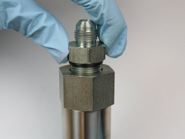 Thread in hydraulic fitting to adapter fitting