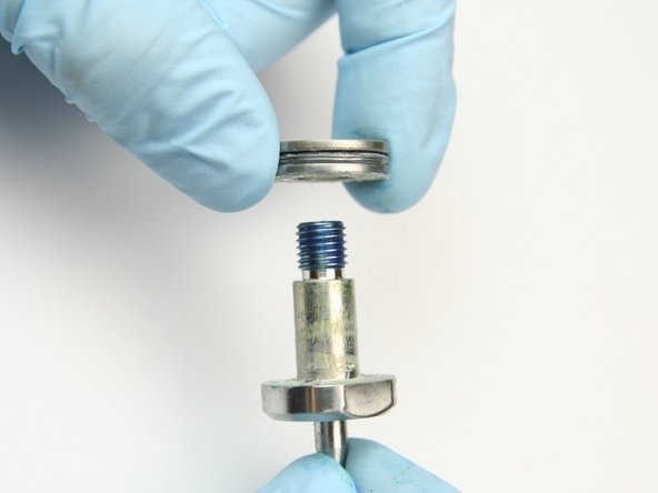 Remove the thrust washers and the thrust bearing from the swivel shaft.