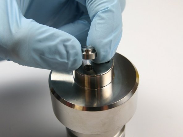 Remove the inlet poppet from  the check valve body.