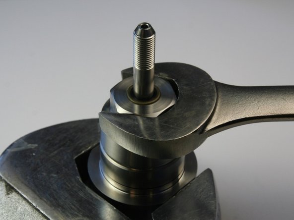 Roll the O-ring until it rests in the cavity of the swivel housing covering the two small holes.