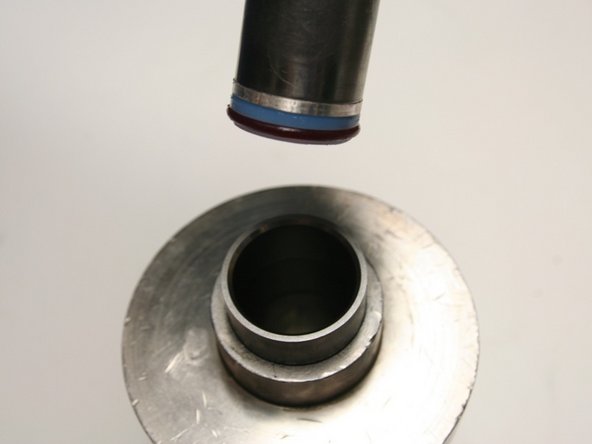 Put the installation tool with the hoop and seal into the sleeve.