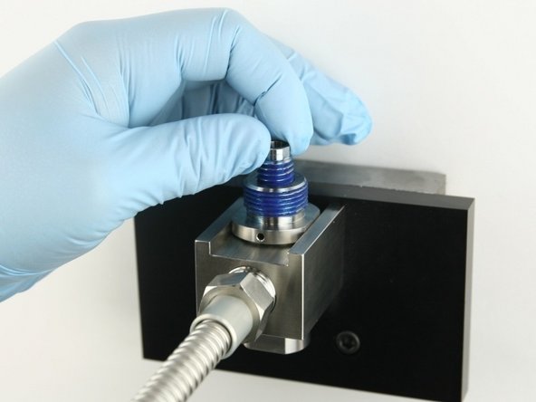 Thread the valve screw into the valve body until it bottoms out.