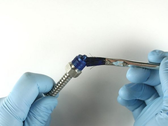 Apply blue goop to gland nut