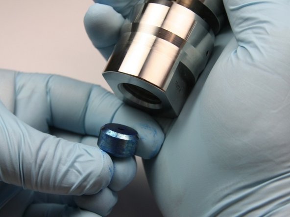 Insert the high-pressure seat into the sealing head body with the Blue Goop side first.