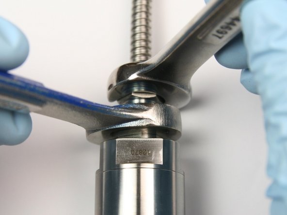 Tighten high-pressure gland into swivel nut with 5/8&quot; and 11/16&quot; wrenches.