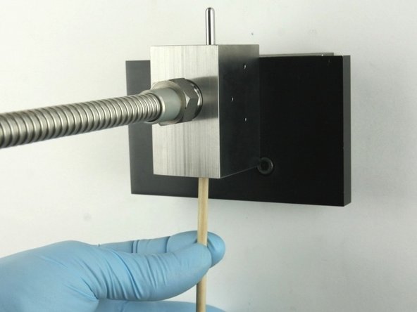 Remove all the valve components from the valve body with the included dowel.