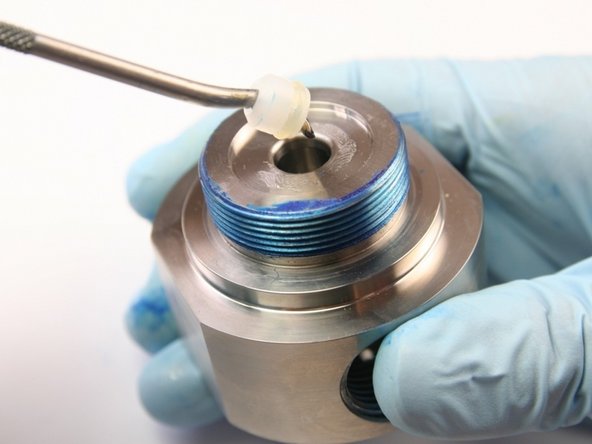 Use a pick to remove the high-pressure seal inside the seal half of the swivel housing.