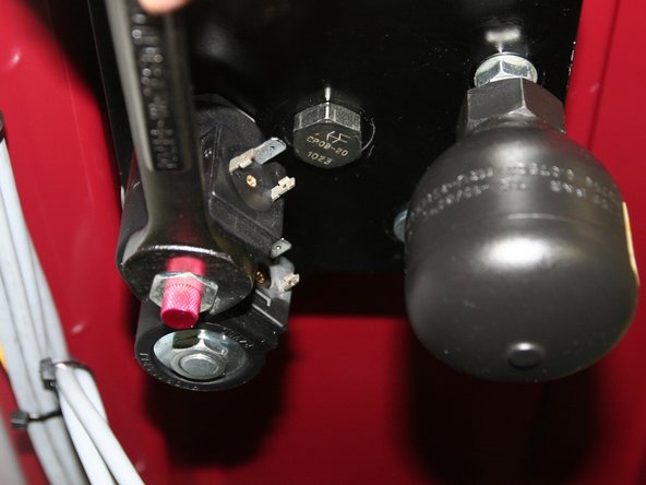 Remove both 24VDC coils from solenoids on back of old control manifold.