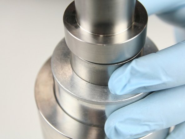 Put the non-stepped end of the push tool into the sleeve and be sure that the tool is level with the sleeve.