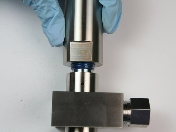 With the piston assembly installed, thread the actuator housing onto the valve body.