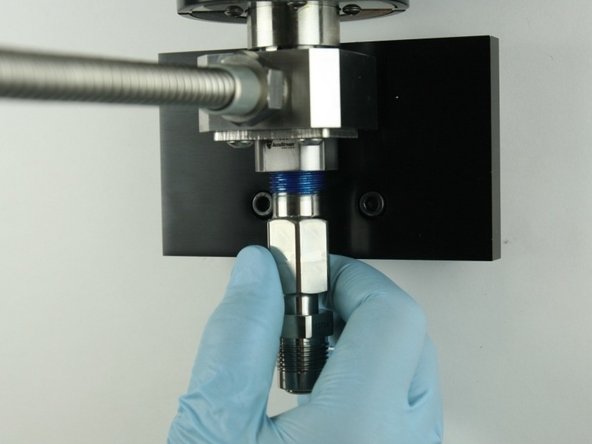 Thread the adapter into the valve body.